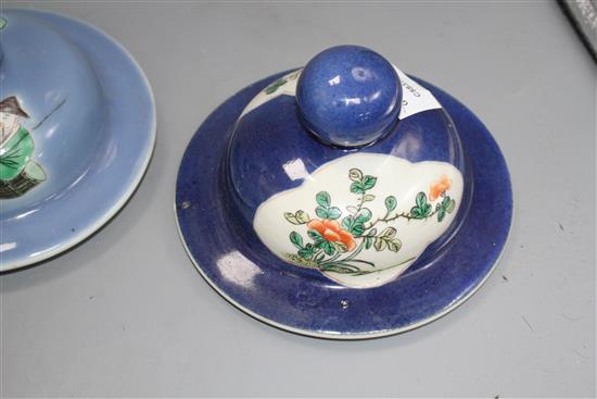 Three Chinese blue ground covers, late 19th century, including a pair with famille verte reserves, diameter approx. 17cm, internal rim